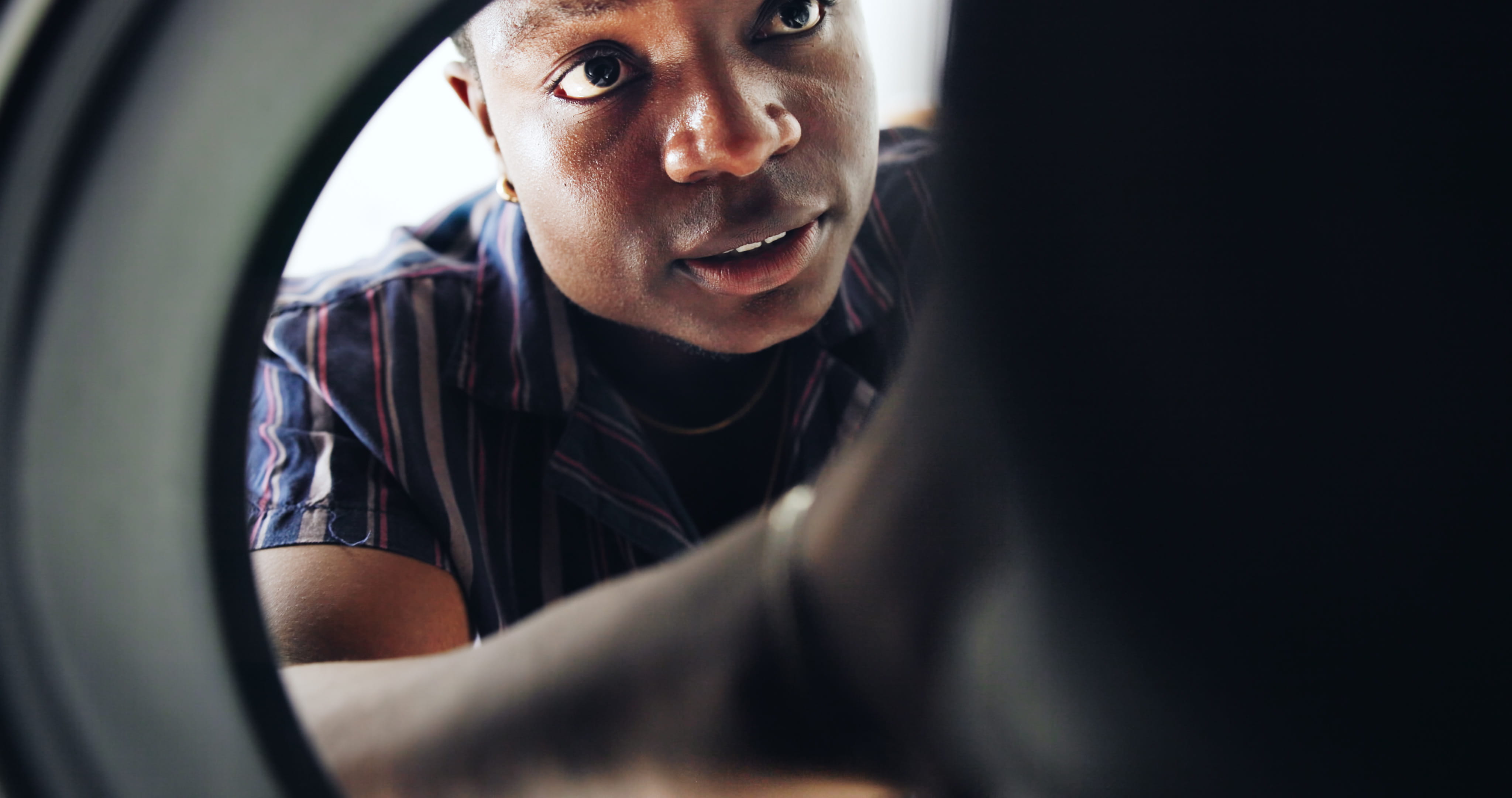 Front-loader washing machine drum inspection during a Sandton repair visit